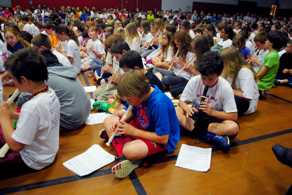 Students at School in Scarborough perform songs on their recorders for the school's final assembly June 13.